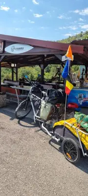 a bike parked under a tent with a flag at Livari CAMPING in Livari