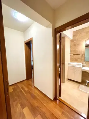 a room with a bathroom with a sink and a mirror at Podgorica Apartment Center in Podgorica