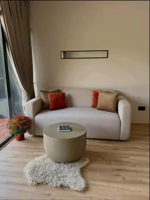 a living room with a couch and a coffee table at LuxEcoCottage in Podgorica