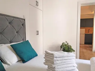 a bedroom with a bed with towels on it at Little Heaven Escape in Budva