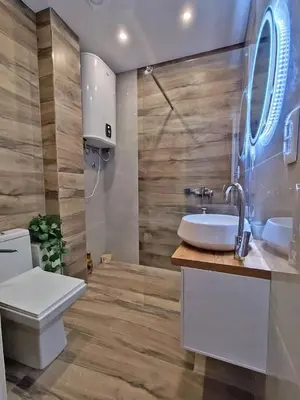 a bathroom with a white sink and a toilet at Little Heaven Escape in Budva