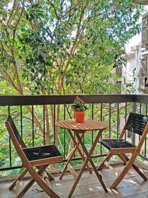 a small table and two chairs on a balcony at Little Heaven Escape in Budva