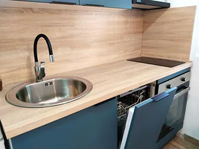 a kitchen counter with a sink and a dishwasher at Little Heaven Escape in Budva