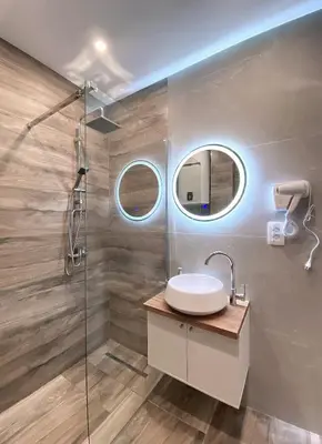 a bathroom with a sink and a shower at Little Heaven Escape in Budva
