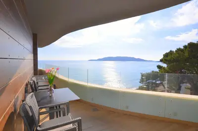 a balcony with a view of the water at Azure Corner Residence Budva - Seaside Living Apartments in Becici
