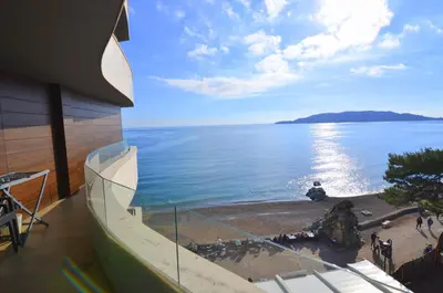 a view of the ocean from the balcony of a building at Azure Corner Residence Budva - Seaside Living Apartments in Becici