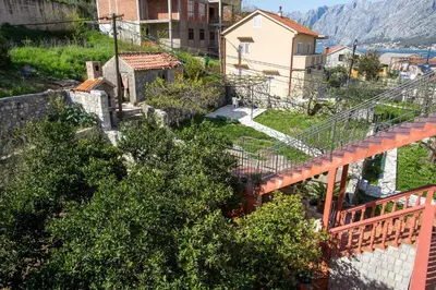 an overhead view of a town with a bridge at Piano apartments in Kotor
