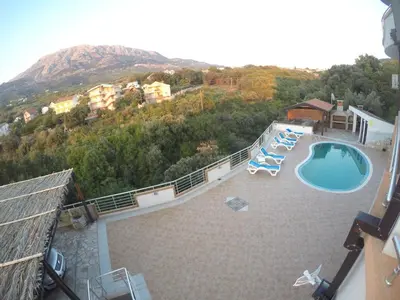 a view of a swimming pool on top of a house at Belvedere Apartments with Seaview in Dobra Voda
