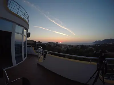 a view of the sunset from the balcony of a house at Belvedere Apartments with Seaview in Dobra Voda