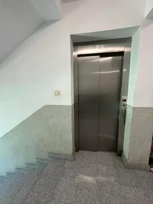 a elevator in a building with a staircase at Apartman Tijana in Budva