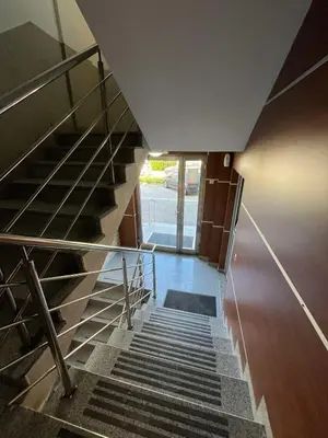 a staircase in a building with a metal stair case at Apartman Tijana in Budva