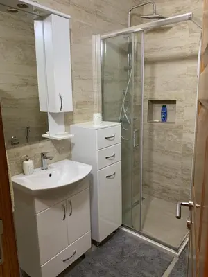 a bathroom with a sink and a shower at Braća Velić in Bar