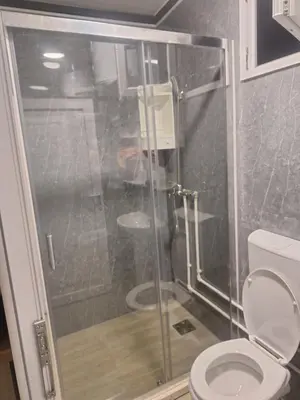 a bathroom with a shower and a toilet at Seosko domaćinstvo Čarobna ravnica in Podgorica