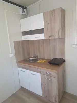 a kitchen with a sink and a counter top at Seosko domaćinstvo Čarobna ravnica in Podgorica