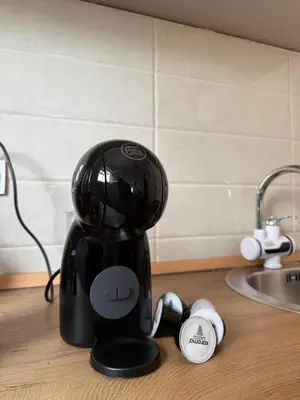 a coffee maker sitting on a counter next to a sink at Comfort corner Podgorica in Podgorica