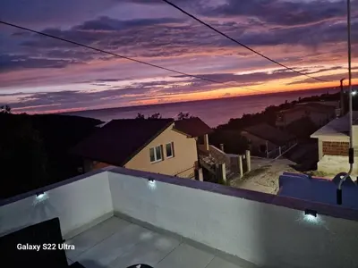a view of a sunset from the roof of a house at Apartmani Kruče in Ulcinj