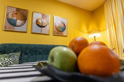 a bowl of fruit on a table in a hotel room at Apartment Mia in Podgorica