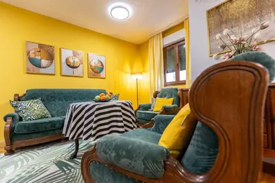 a living room with two couches and a table at Apartment Mia in Podgorica