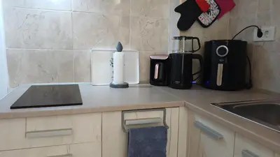 a kitchen counter with a candle and a blender at Central Sea View Studio Budva in Budva