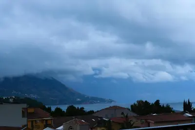 a view of a city with a mountain in the background at Central Sea View Studio Budva in Budva