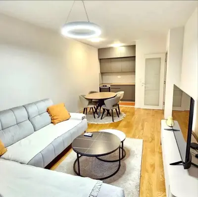 a living room with a couch and a table at Mia Suites in Podgorica