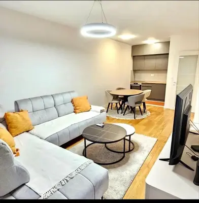 a living room with a couch and a table at Mia Suites in Podgorica