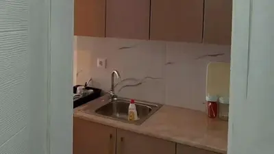 a kitchen with a sink and a counter top at Apartment Pinješ in Ulcinj