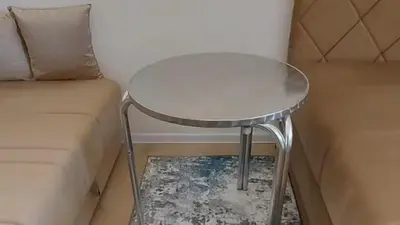 a small table next to a couch in a room at Apartment Pinješ in Ulcinj