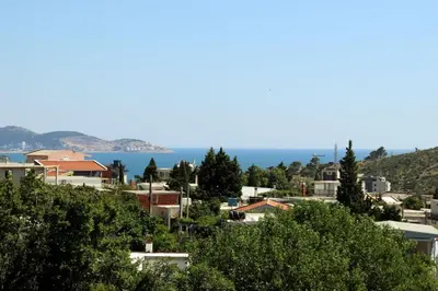 a city with the ocean in the background at Teona-Apartments in Sutomore