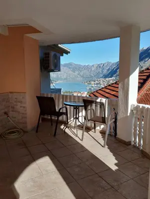 a view from the balcony of a house with a table and chairs at Apartman Blazo in Škaljari