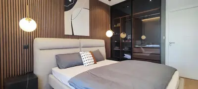 a bedroom with a large bed in a room at City Living with Style - Elegant One-Bedroom Apartment in Podgorica