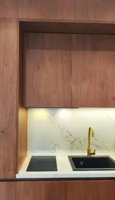 a kitchen with a sink and a counter top at City Living with Style - Elegant One-Bedroom Apartment in Podgorica