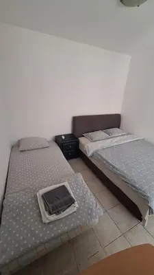 two beds sitting next to each other in a room at Simpi in Pržno