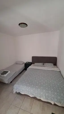 two beds in a room with a wall at Simpi in Pržno