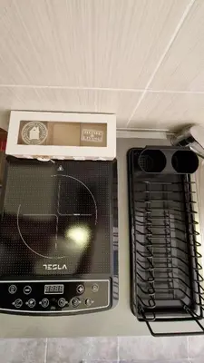 a toaster oven with a box on top of it at Mirko's home 2 Studio Apartment in Podgorica