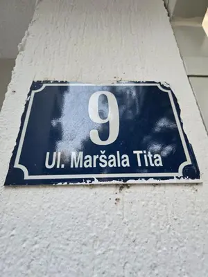 a sign on a wall with the number nine at Sena in Bar