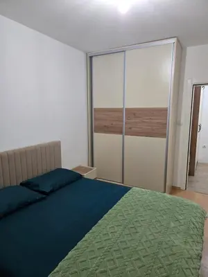 a bedroom with a bed and a view of the ocean at Sena in Bar