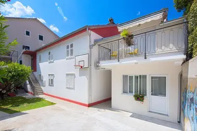 a building with a basketball hoop on the side of it at Apartment Kotor Bay in Kotor