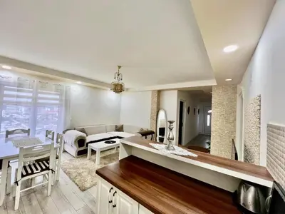 a kitchen and living room with a dining room at PrivatHomeUlcinj1 in Ulcinj