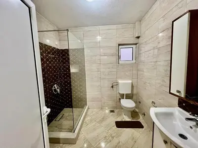 a bathroom with a shower and a toilet and a sink at PrivatHomeUlcinj1 in Ulcinj