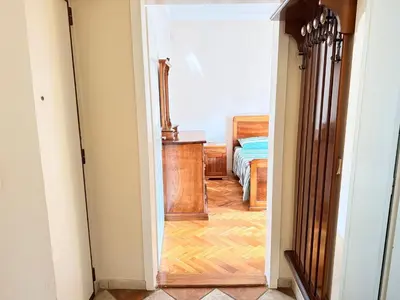 a hallway with a door leading to a bedroom at Charming terrace studio in Podgorica