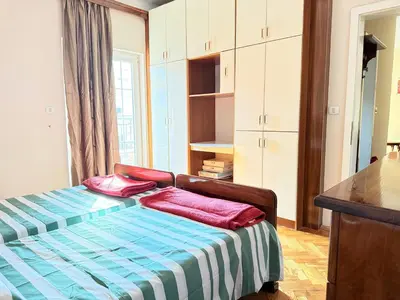 a bedroom with a bed with two pillows on it at Charming terrace studio in Podgorica