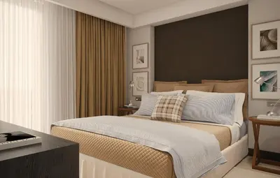 a bedroom with a large bed and a desk at Hotel Madeira in Budva