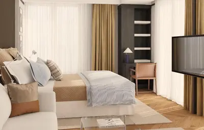 a living room with a bed and a tv at Hotel Madeira in Budva
