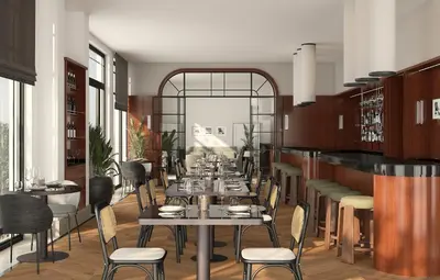 a restaurant with tables and chairs in a room at Hotel Madeira in Budva