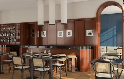 a dining room with a table and chairs at Hotel Madeira in Budva