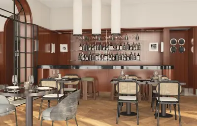 a restaurant with tables and chairs and a bar at Hotel Madeira in Budva