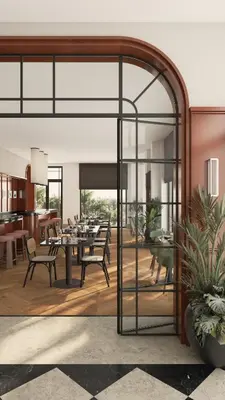 a dining room with a table and chairs at Hotel Madeira in Budva