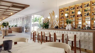 a restaurant with a bar with tables and chairs at Iberostar Selection Montenegro in Bar