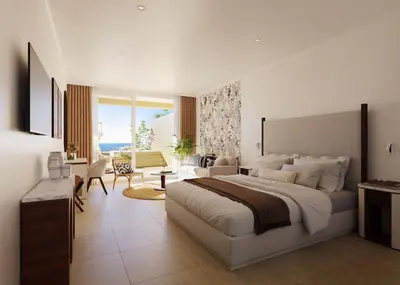 a bedroom with a large bed and a living room at Iberostar Selection Montenegro in Bar